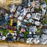 Aerial shot showcasing diverse scrap metal piles in a Saint Charles junkyard.