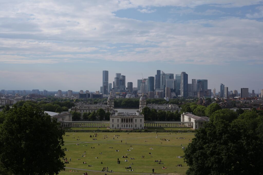 A panoramic view of London skyline from Greenwich Park during summer.